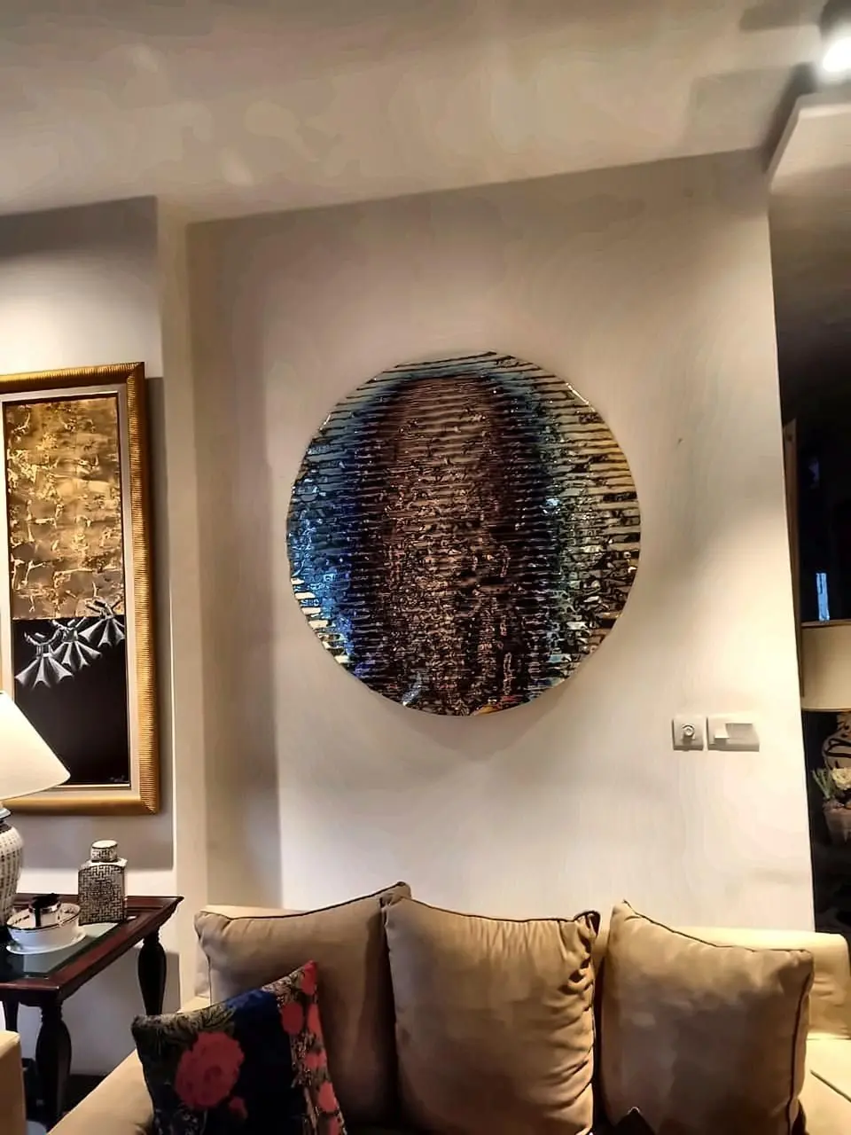 Circular hammered-mirror sculpture