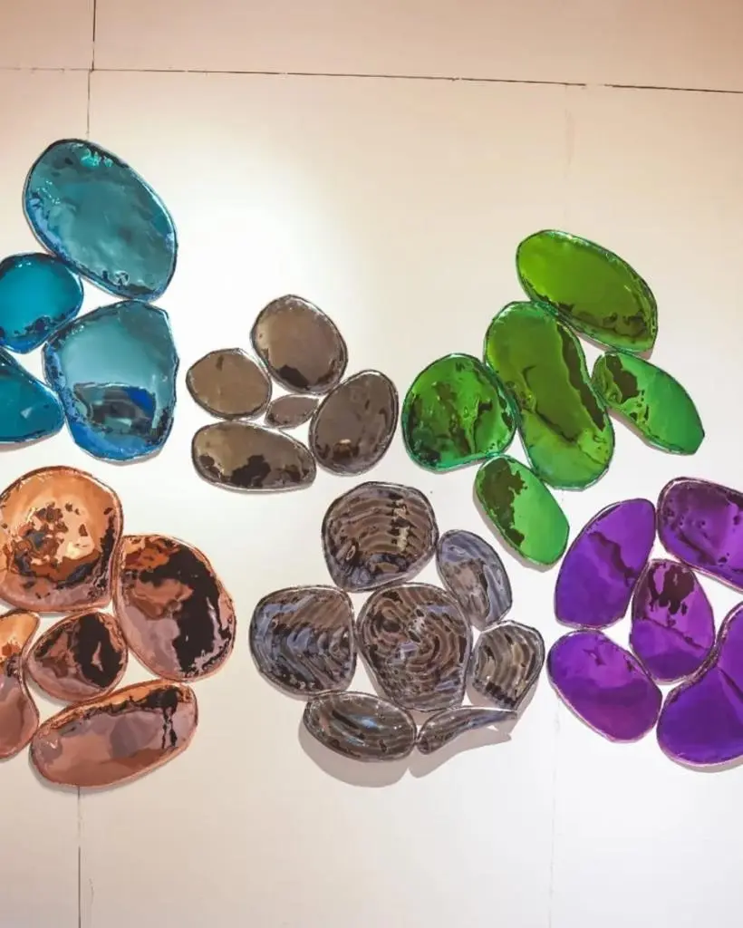 Cluster of mixed-finish mirror pebble forms