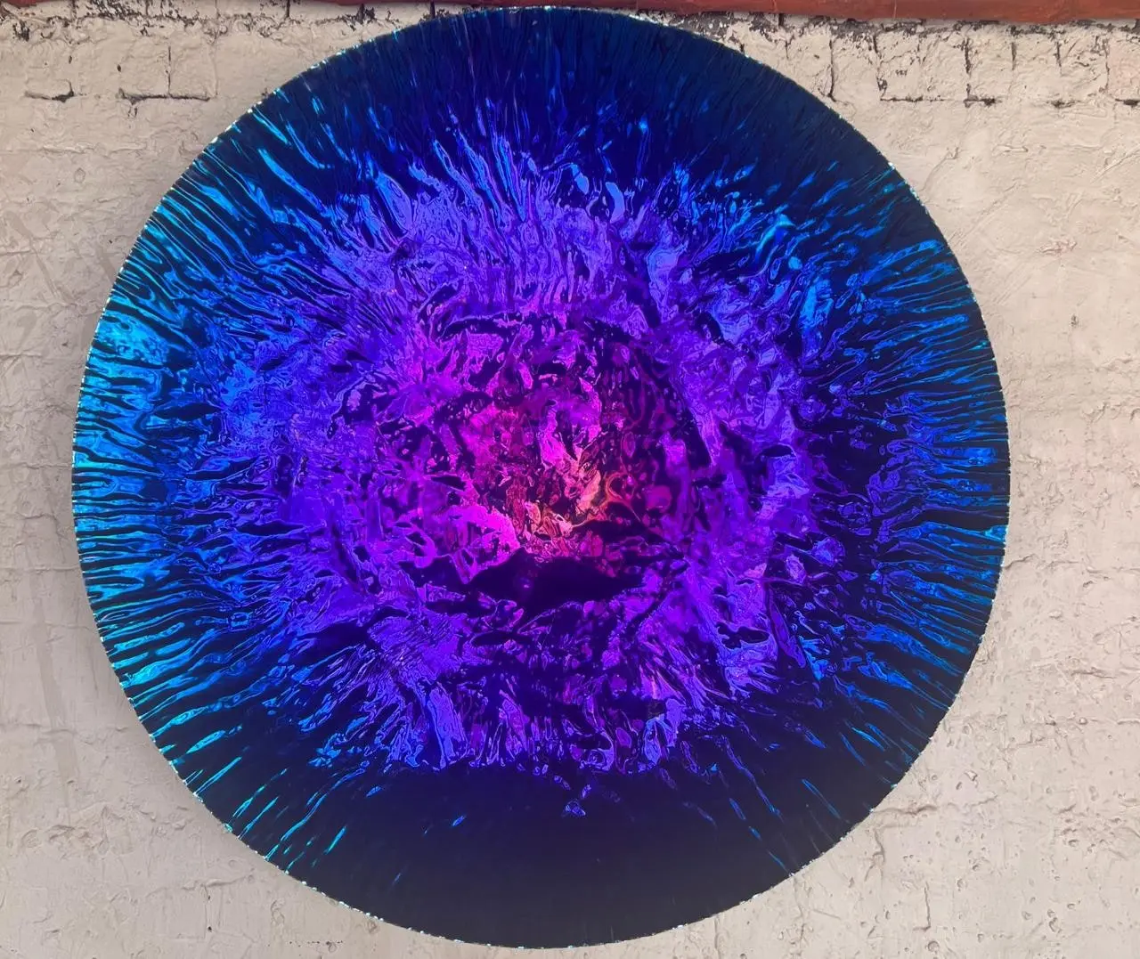Iridescent violet radial-burst mirror disc
